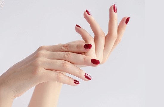 hands with manicured red nails