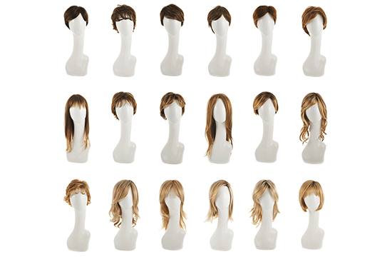 an assortment of styled wigs